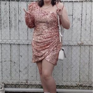 This is a dress from Alyce. Size 15. A mini, one shoulder, sequined dress.